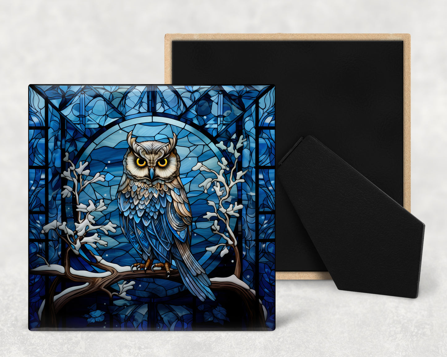 a card with an owl sitting on a branch in front of a stained glass window