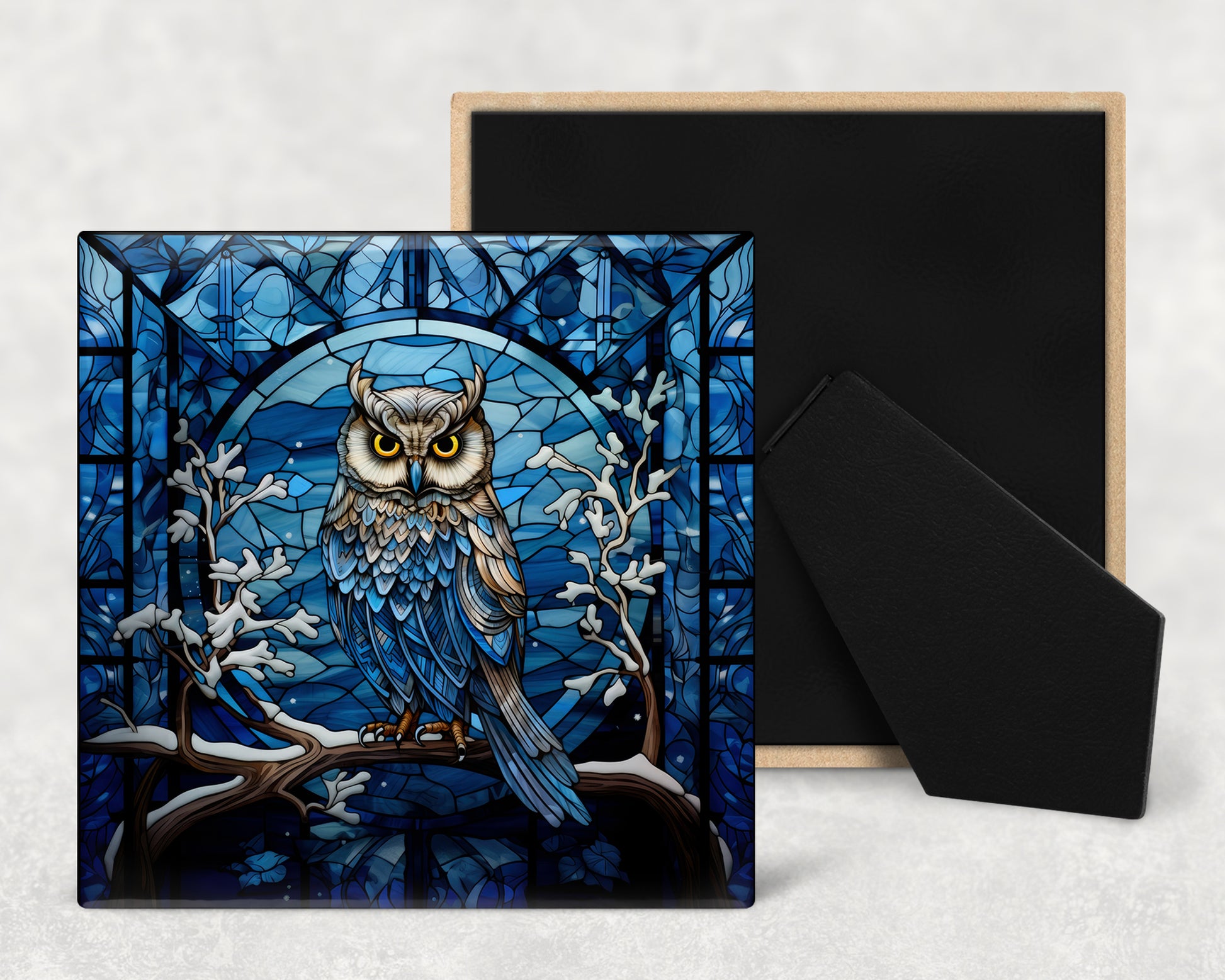 a card with an owl sitting on a branch in front of a stained glass window