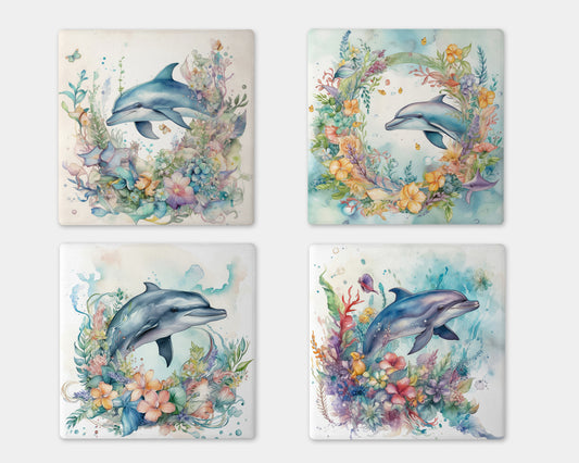 four coasters with dolphins and flowers on them