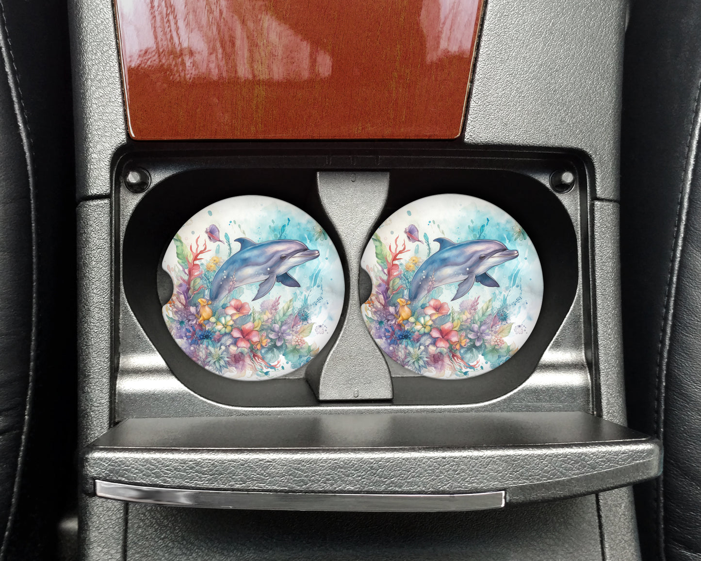 two plates with dolphins painted on them in a car